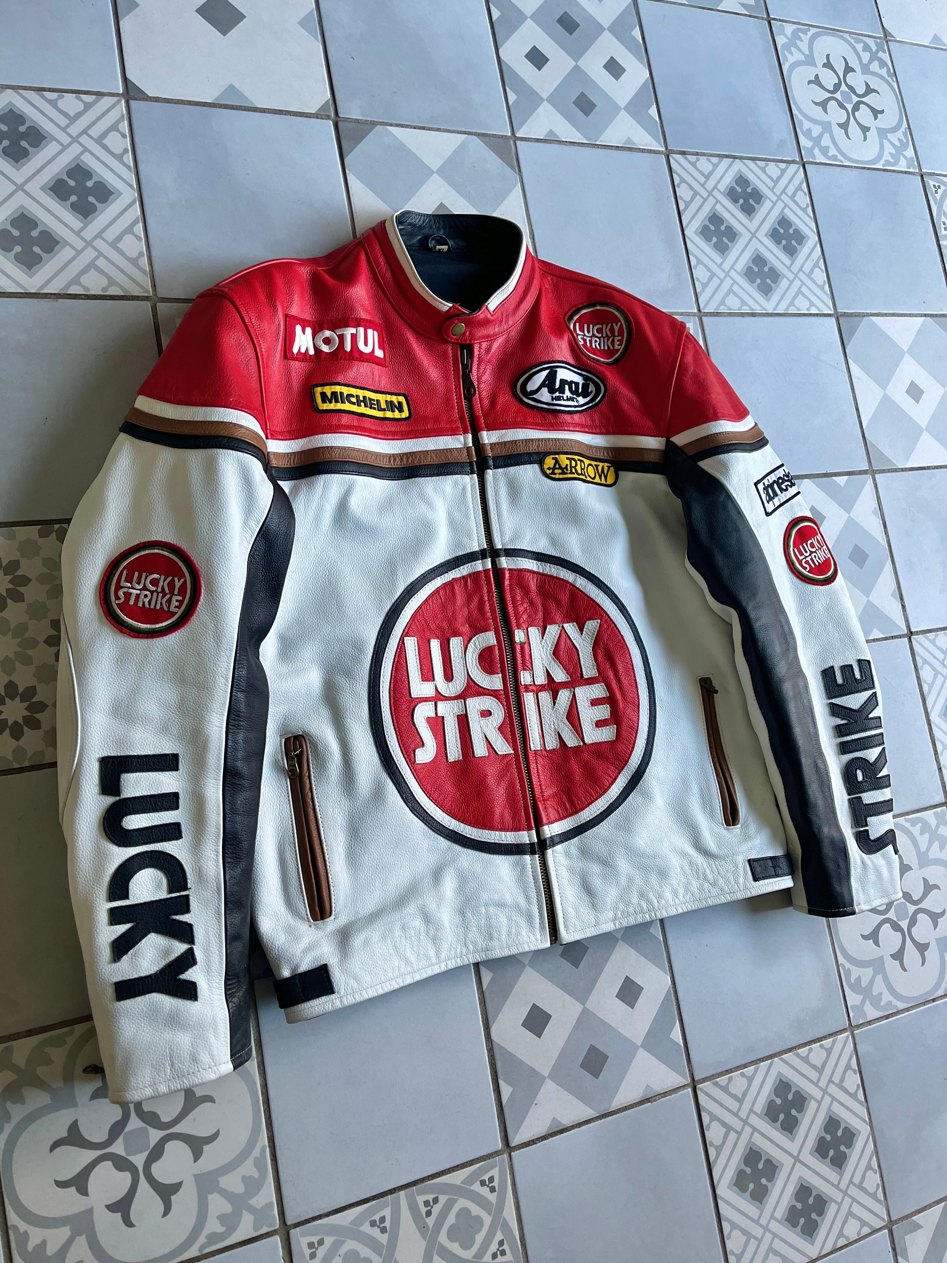 Manches de veste racing avec patchs de sponsors moto vintage et finitions zippées